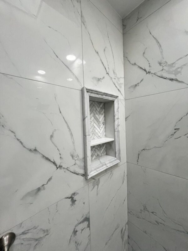 modern walk-in shower with frameless glass and tile work in Philadelphia bathroom remodel