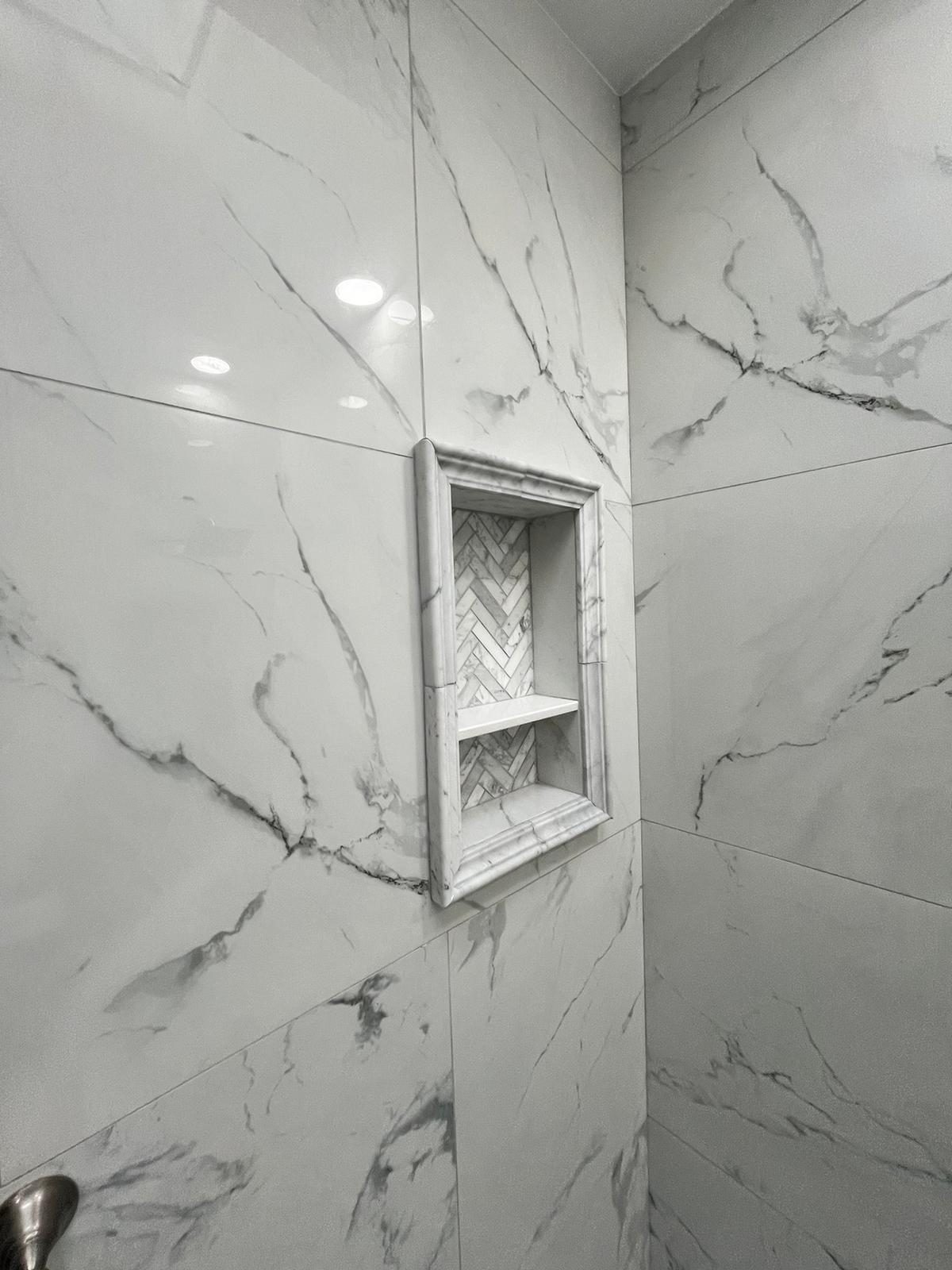 waterproof shower pan with linear drain and sloped floor membrane before tile installation