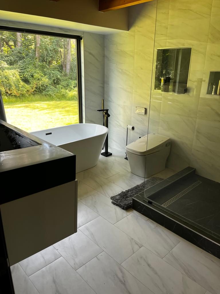 low flow showerhead and sustainable tile in renovated bathroom