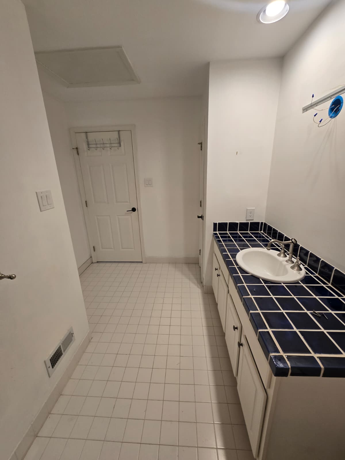 Bathroom before renovation in Ambler, PA, showing the original floor