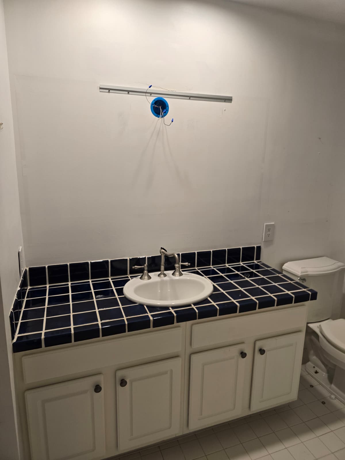 Bathroom before renovation in Ambler, PA, showing the original vanity